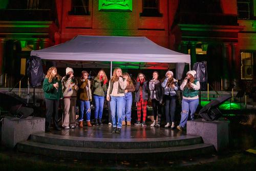 Plymouth North High School a cappella group Spectrum entertains in front of Town Hall before the Christmas Tree Lighting.